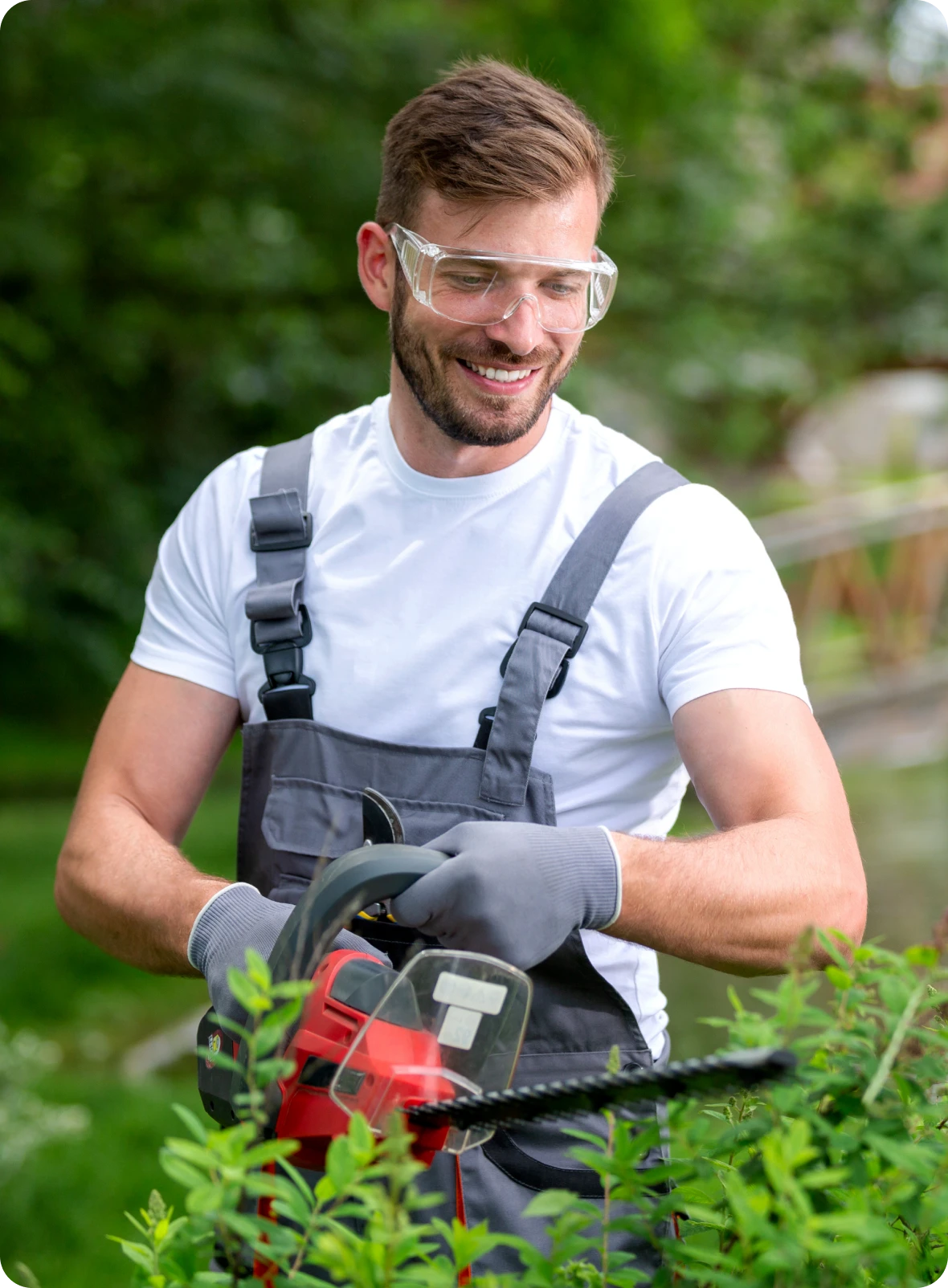 Gardener wearing safety gear outdoors