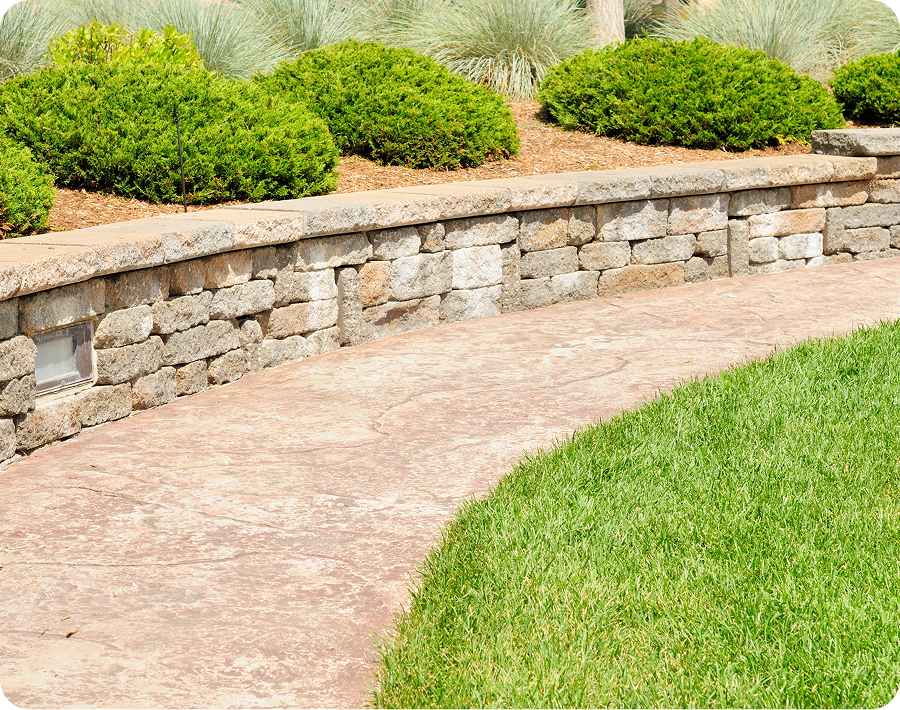 Stone wall beside a garden path