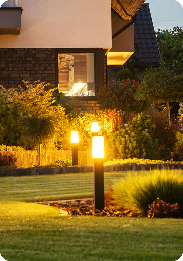 House exterior with lit garden path